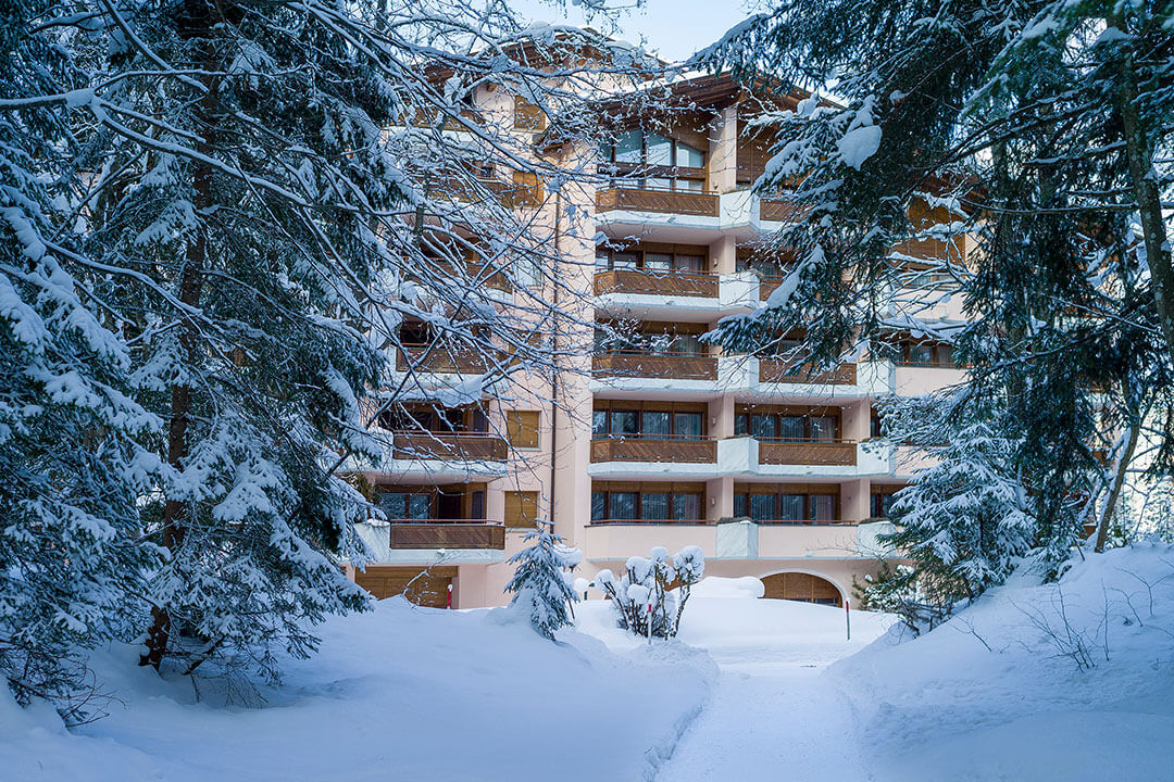 exterior view of chalet belmont building in winter